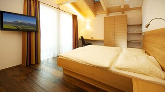 Schlafzimmer mit Frühstück in Saalfelden | © Pension Kröll